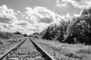 Photography to theme railway track after passing train on railroad photo