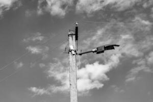 Power electric pole with line wire on dark background close up photo