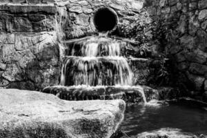 Photography on theme beautiful fall water from garden waterfall photo