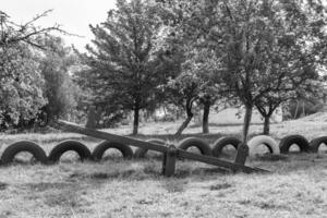 Photography on theme empty playground with metal swing for kids photo