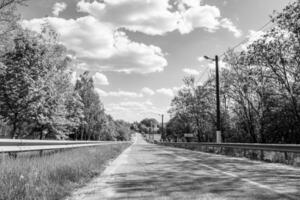 Beautiful empty asphalt road in countryside on light background photo