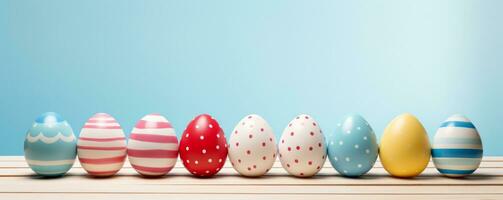 AI generated colorful easter eggs lined up on a wooden table photo