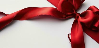 AI generated a red satin ribbon with bow on a white background photo