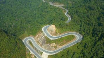 Scenic winding mountain road on the Ha Giang Loop, North Vietnam Aerial video