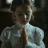 AI generated first communion girl with hands on chest praying photo