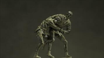 Bronze statuette of two men wrestling with each other close up. Champion wrestling Cup. Metal figurine on wrestling. photo