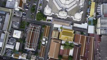 Nice view from the top of houses with tiled roofs. Top view of modern and old houses of the city. Cityscape of town and city from top view. Old and modern architecture of different styles. Authentic photo