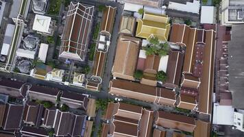 Nice view from the top of houses with tiled roofs. Top view of modern and old houses of the city. Cityscape of town and city from top view. Old and modern architecture of different styles. Authentic photo