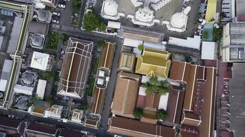 Nice view from the top of houses with tiled roofs. Top view of modern and old houses of the city. Cityscape of town and city from top view. Old and modern architecture of different styles. Authentic photo