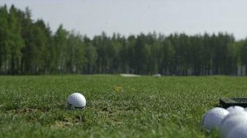 Man playing game of golf. Man hitting Golf ball photo