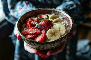 AI generated people holding a bowl of oatmeal with strawberries and bananas photo