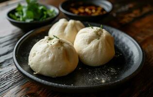 AI generated steamed buns are sitting on a plate on a black background photo