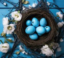 AI generated a nest with blue eggs and flowers in blue on white wood photo