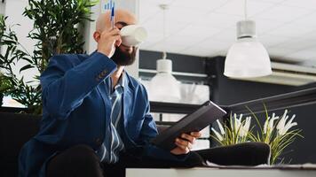 Executive manager searches for solution in development next step, looking at marketing data to find new business strategy. Company expert trying to develop new plan to increase profit. photo