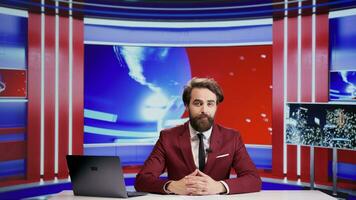Media journalist talks about news segment on live television, addressing everyday important topics for advertisement. Man reporter presenting breaking news on tv program, doing newscast. photo