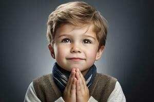 AI generated Adorable Young Boy with Hands Together on Gray Background photo