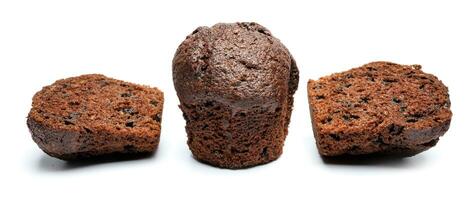 Whole and cut in half chocolate muffin isolated on white background. Chocolate chip muffin. photo