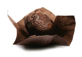 Chocolate muffin isolated on white background . Muffin with chocolate chips. photo