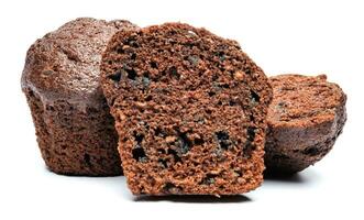 Whole and cut in half chocolate muffin isolated on white background. Chocolate chip muffin. photo