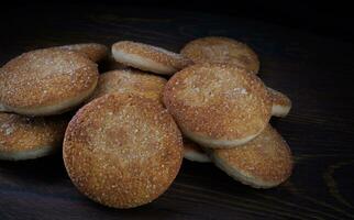 Beautiful round cookies on a wooden board. A few cookies. A bunch of cookies. photo