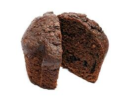 Chocolate muffin cut in half isolated on a white background. Chocolate chip muffin. photo