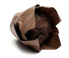 Chocolate muffin isolated on white background . Muffin with chocolate chips. photo