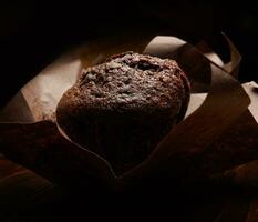 Chocolate muffin close-up .Muffin with chocolate chips. photo