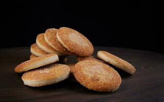 Beautiful round cookies on a wooden board. A few cookies. A bunch of cookies. photo