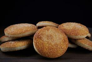 Beautiful round cookies on a wooden board. A few cookies. A bunch of cookies. photo