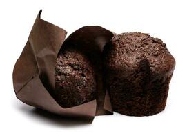 Two chocolate muffins isolated on a white background . Muffin with chocolate chips. photo