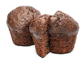 Whole and cut in half chocolate muffin isolated on white background. Chocolate chip muffin. photo