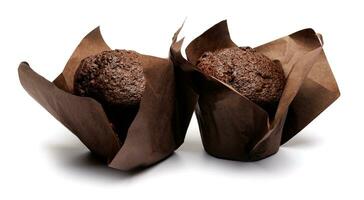 Two chocolate muffins isolated on a white background . Muffin with chocolate chips. photo