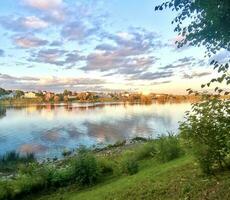 cottage village on the banks of the Volga before sunset photo