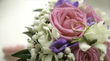 Wedding bouquet of roses. Bride's bouquet on wedding day. Bouquet of different flowers. Bouquet of beautiful pink and white or red roses on the dressing stool. Roses photo