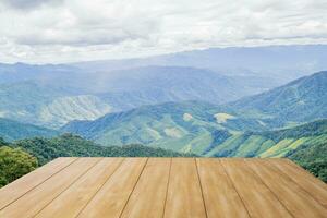 Wooden table on mountain view photo