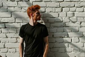 AI generated Redheaded man in black t-shirt standing on brick wall background. photo