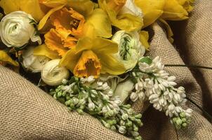 a bouquet of yellow and white flowers photo