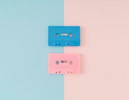 Layout of retro pink and blue audio cassette tapes on light pastel pink and blue background. Creative concept of retro technology. 80's aesthetic. Vintage audio cassette tape idea. Retro nostalgia. photo