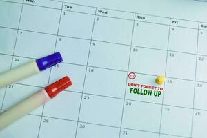 Don't Forget to Follow Up text white calendar background. Reminder or schedule concept photo