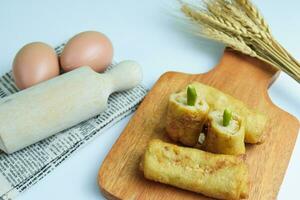 Risoles sosis mayo American risoles or mayonnaise sausage rissole is a small patty rolled in breadcrumbs. photo