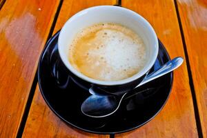 close up view of a cup of cappuccino coffee photo