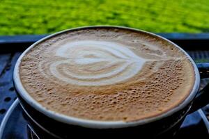 close up view of a cup of cappuccino coffee photo