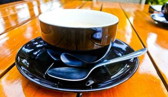 close up view of a cup of cappuccino coffee photo