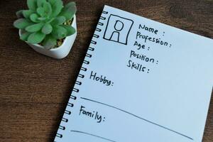 Concept of User's Persona write on book isolated on Wooden Table. photo