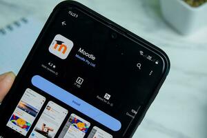 Moodle application on Smartphone screen. Moodle is a freeware web browser developed by Moddle Pty Ltd. Bekasi, Indonesia, Januay 8, 2023 photo