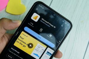 Microsoft Power BI application on Smartphone screen. Power BI is a freeware web browser developed by Microsoft Corporations, Inc. Bekasi, Indonesia, Januay 4, 2023 photo