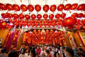 Atmosphere inside Wat Mangkon Kamalawat ,Leng Neey Yi. People come to worship and pray for blessings from in Wat Mangkon. Chinese New Year on Yaowarat Road photo