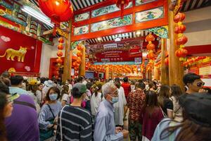 Atmosphere inside Wat Mangkon Kamalawat ,Leng Neey Yi. People come to worship and pray for blessings from in Wat Mangkon. Chinese New Year on Yaowarat Road photo