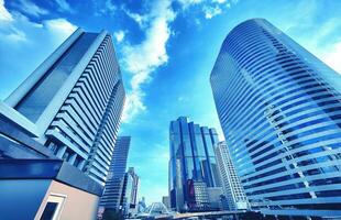 Wide view of business district skyscrapers with modern office buildings in the capital city of Bangkok, Thailand. photo