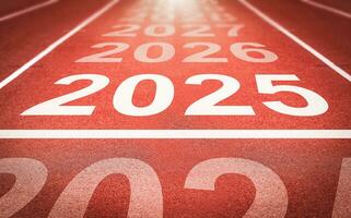 Start of new year. Changes of year 2025, 2026, 2027 on Running track. Concept of new ideas starting in new year, planning along with setting objectives to set KPI goals for success in life. photo